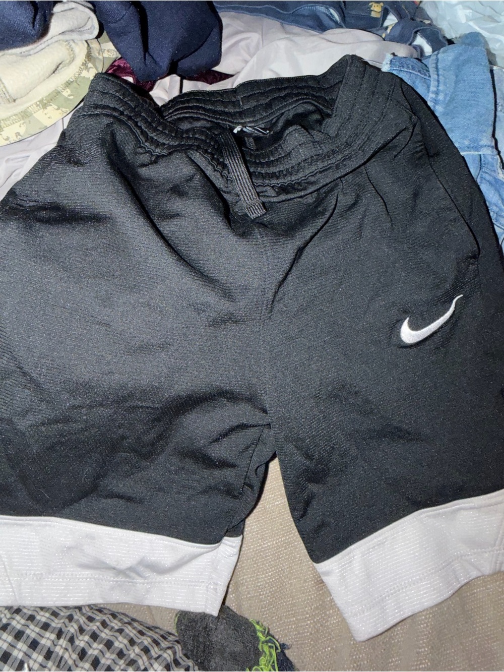 Nike boy’s in Black Athletic Shorts with White Hem and Swoosh